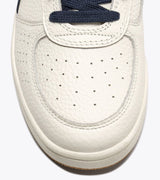 B. ELITE Dominio | White/Peacoat | DIADORA