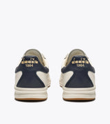 B. ELITE Dominio | White/Peacoat | DIADORA