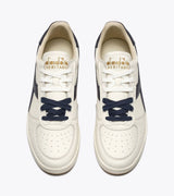 B. ELITE Dominio | White/Peacoat | DIADORA